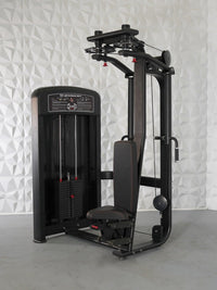 Thumbnail for Black pec deck/rear delt machine with adjustable seat and weight stack against a white textured wall.