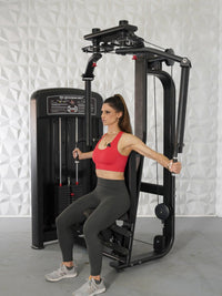 Thumbnail for Woman in red top and gray leggings using a black pec deck/rear delt machine.