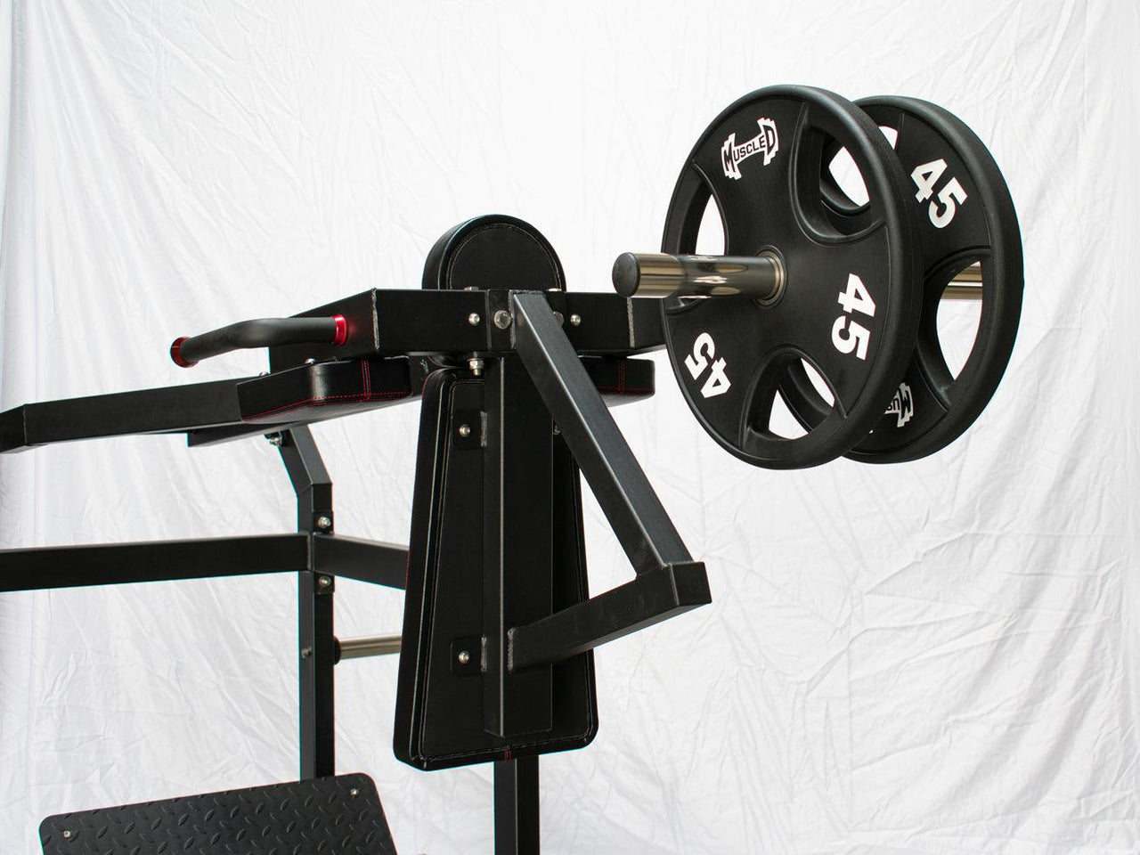 Black plate-loaded squat machine with two 45lb weight plates on the right, and a footplate on the bottom left.