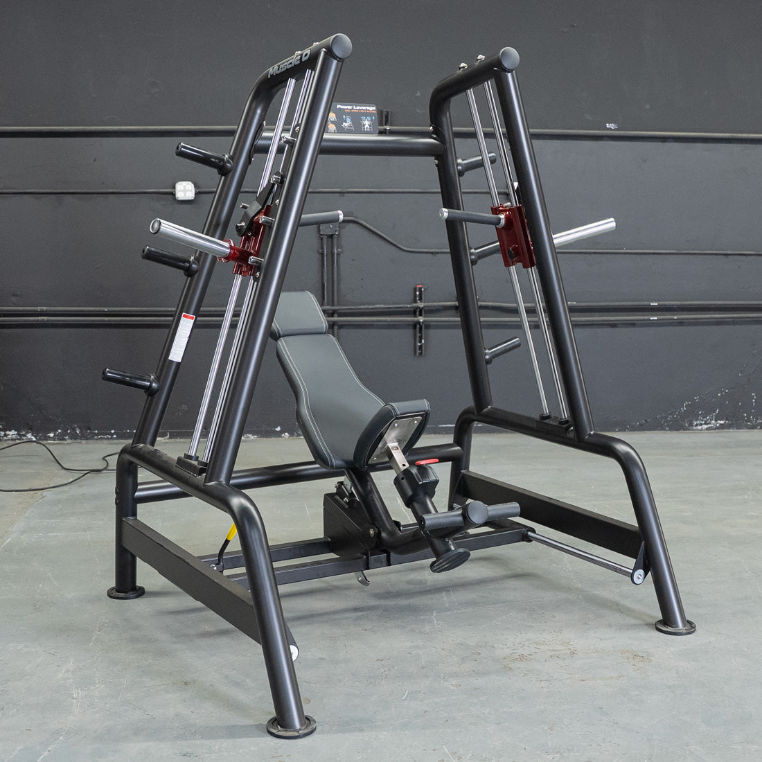Black and gray Power Leverage V2 Convergent Bench with an adjustable seat and weight plate holders.