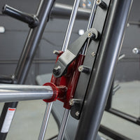 Thumbnail for Close-up of a red and black weight machine's bar and adjustment mechanism.
