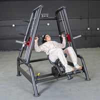 Thumbnail for Woman performing an incline press on a black Power Leverage V2 Convergent Bench in a gym.