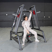 Thumbnail for Woman using a black and red Power Leverage V2 Convergent Bench for a shoulder press in a gym.