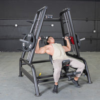 Thumbnail for Man using a black incline bench press machine with weight plates in a gym.