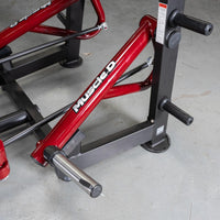 Thumbnail for Close-up of a red and black Muscle D Fitness chest fly machine with chrome weight horns and black handles.