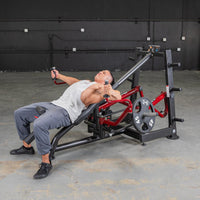 Thumbnail for Man performing decline chest fly on a red and black leverage machine with 45lb plates.