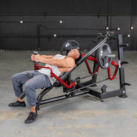 Thumbnail for Man using a red and black decline chest fly machine with 45lb plates in a gym.