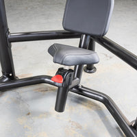 Thumbnail for Close-up of a black decline chest press machine's seat and backrest with a red adjustment lever.