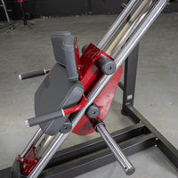 Thumbnail for Red and black hack squat machine with padded backrest, shoulder pads, and hand grips.