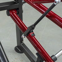 Thumbnail for Close-up of a red and black horizontal chest press machine frame with an adjustment knob.