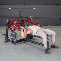 Thumbnail for Man using a red and black horizontal chest press machine with a 45lb weight plate.