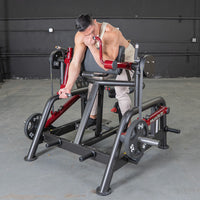 Thumbnail for Man using a red and black biceps curl machine with 25lb weight plates in a gym.