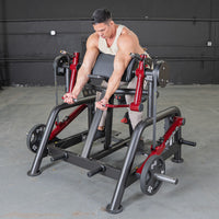 Thumbnail for Man performing biceps curl on a red and black iso-lateral preacher curl machine with 25lb plates.