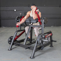Thumbnail for Man using a black and red biceps curl machine with 25lb weights in a gym.