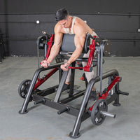 Thumbnail for Man using a black and red biceps curl machine with 25lb weight plates in a gym.