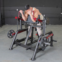 Thumbnail for Man using a black and red biceps curl machine with 25lb weight plates in a gym.