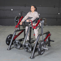 Thumbnail for Woman using a black and red biceps curl machine with weight plates in a gym.