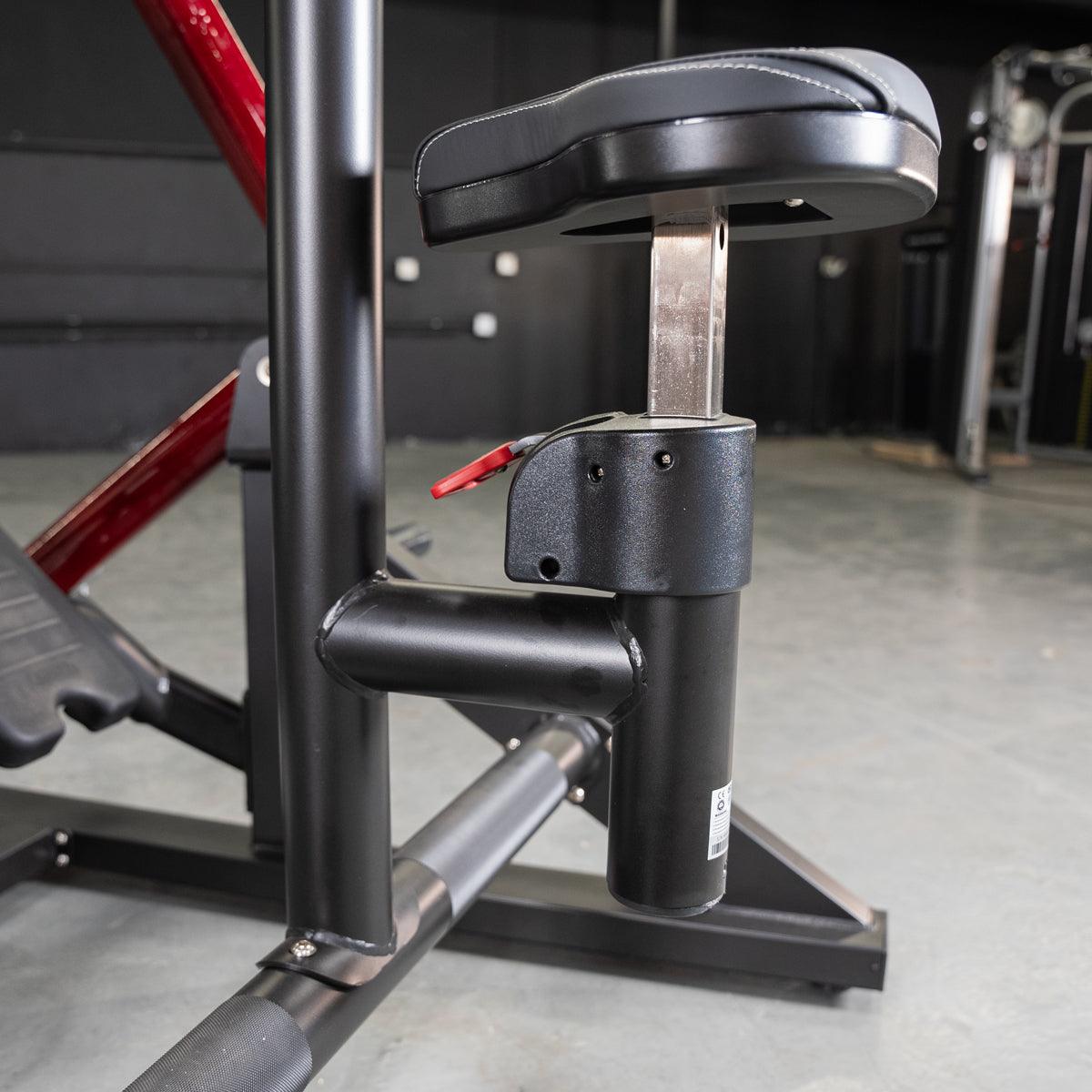 Close-up of the adjustable black seat and red lever on the Power Leverage V2 Iso Lateral Seated Row machine.
