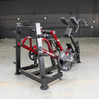 Thumbnail for Red and black Iso Lateral Sprint Trainer with a 45lb weight plate in a gym setting.