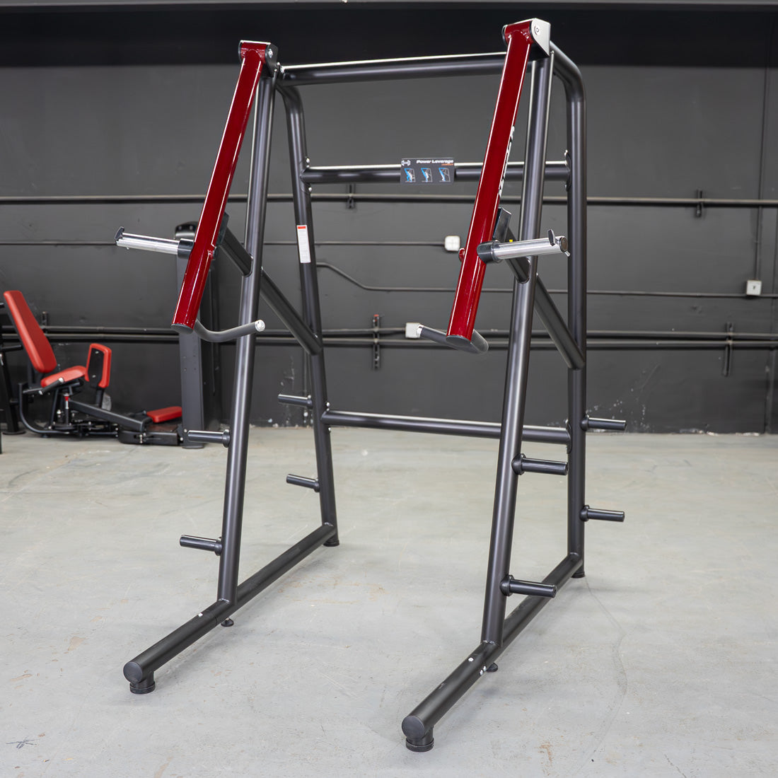 Black and red jammer strength trainer in a gym setting.