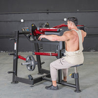 Thumbnail for Man using a red and black lateral raise machine with 25lb weights in a gym.