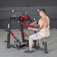 Thumbnail for Man using a red and black lateral raise machine in a gym.