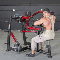 Thumbnail for Man using a red and black lateral raise machine with 25lb weights in a gym.