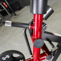Thumbnail for Close-up of a red leg extension machine's adjustment handle and numbered settings.