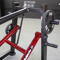 Thumbnail for Close-up of a red and black Power Leverage V2 Overhead Triceps machine with a 25lb weight plate.