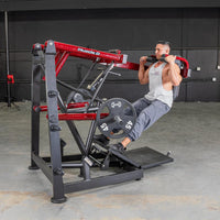 Thumbnail for Man performing squats on a red and black Power Leverage V2 Pendulum Squat machine with 45lb weights.