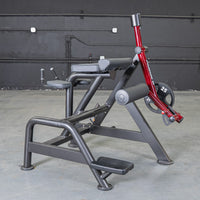 Thumbnail for Black and red reverse hyper machine with padded supports, footrests, and a 25lb weight plate.