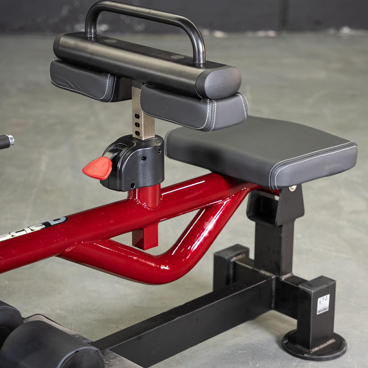 Red and black seated calf/tib machine with adjustable thigh pads and seat.