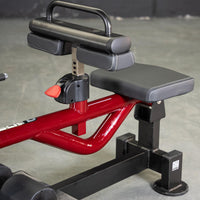 Thumbnail for Red and black seated calf/tib machine with adjustable thigh pads and seat.