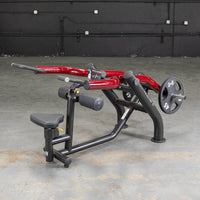 Thumbnail for Black and red seated dip/triceps press machine with a 45lb weight plate on a concrete floor.