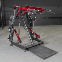 Thumbnail for Red and black Viking press and calf raise machine with weight plates in a gym.