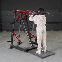 Thumbnail for Woman using a red and black Viking press machine for a shoulder workout.