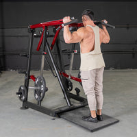 Thumbnail for Man using a red and black Viking press machine for a shoulder exercise.