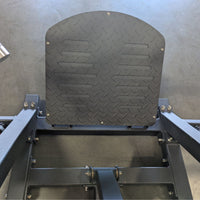 Thumbnail for Close-up of a black diamond plate footrest on a linear bearing row machine.