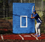 Baseball player chokes up in batting cage with a blue Cagesaver backdrop