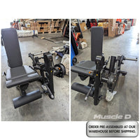 Thumbnail for Black plate-loaded leg extension/curl machine with padded seat and backrest, shown from two angles in a warehouse.