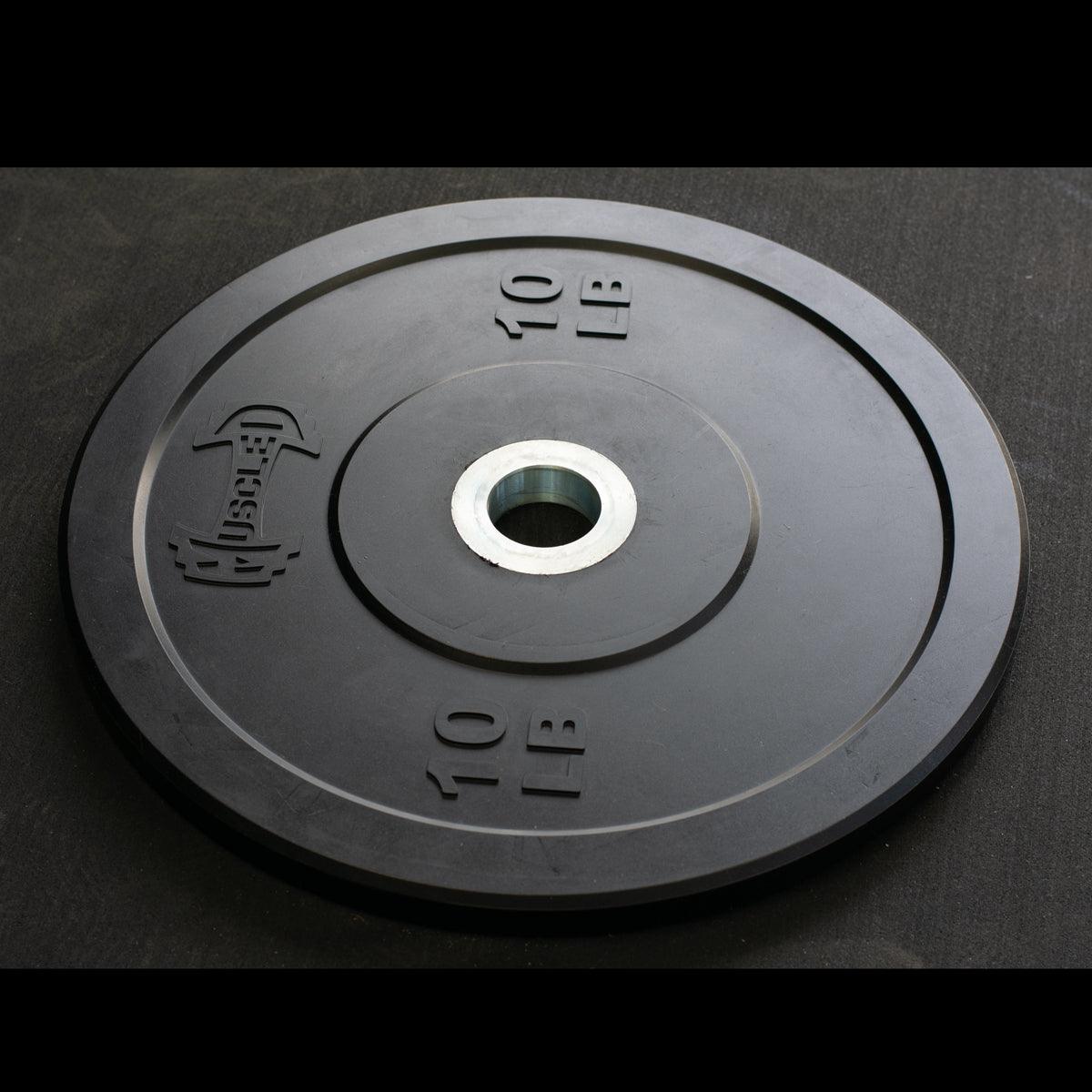 Black 10 lb bumper plate with "Muscle D" logo and steel hub.
