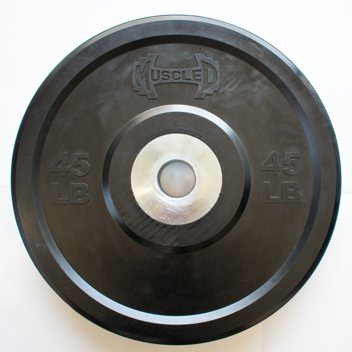Black 45 LB bumper plate with "MUSCLE D" logo and silver center hub.