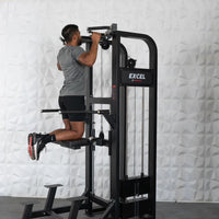Thumbnail for Man performing assisted chin-up on a black Excel selectorized chin/dip combo machine.
