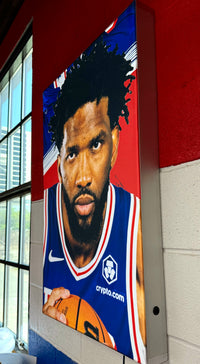 Thumbnail for Side view of a backlit silicone edge graphic lightbox showing a basketball player in a blue jersey holding a ball