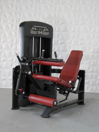 Thumbnail for Black and red leg extension and seated leg curl combo machine with a weight stack.