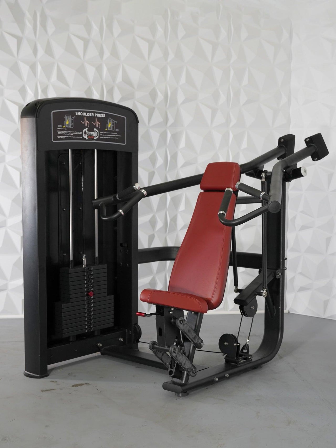 Black and red selectorized shoulder press machine with weight stack and adjustable seat.