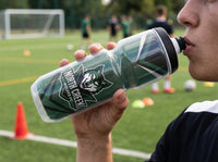 Thumbnail for Person drinking from a clear water bottle with a green 