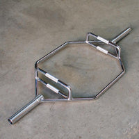 Thumbnail for Shiny chrome hex trap bar with two sets of knurled handles on a concrete floor.