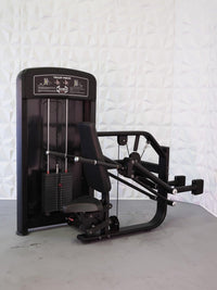 Thumbnail for Black commercial triceps press machine with weight stack, padded seat, and arm levers.