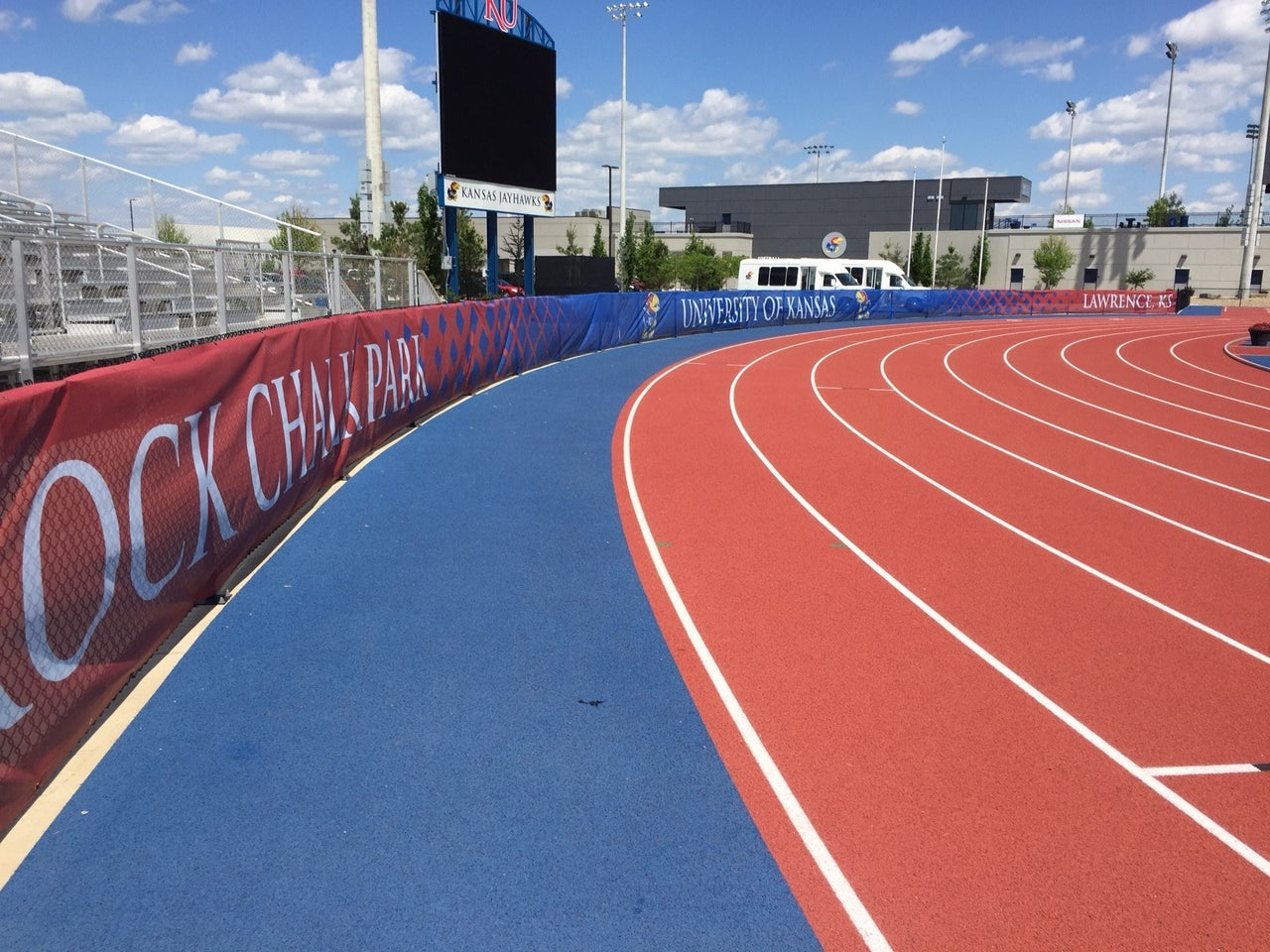 Printed windscreen installed on the University of Kansas track fence